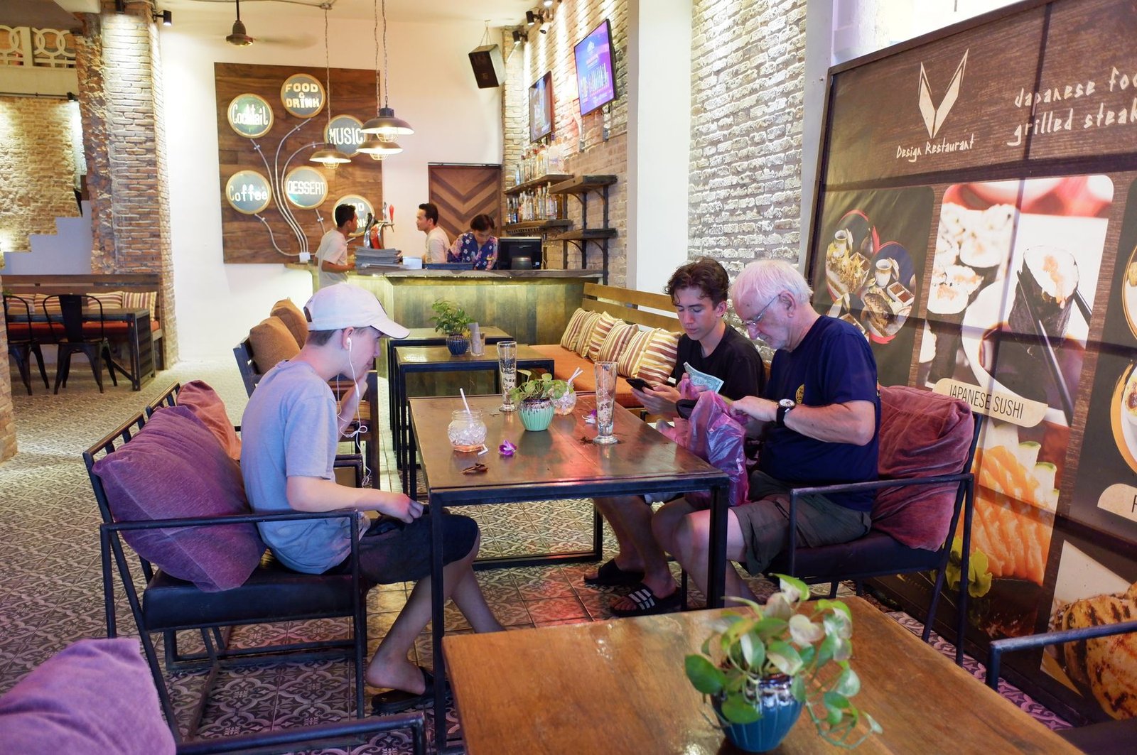 Family relaxing in a restaurant lounge on Pub Street in Siem Reap in the evening